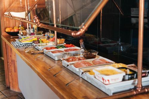 a buffet line with many different types of food at Hotell Siesta in Karlskrona