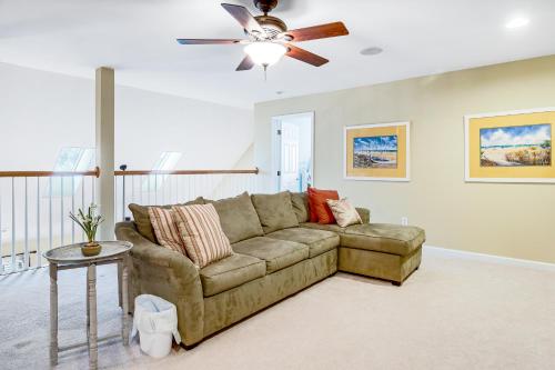a living room with a couch and a ceiling fan at Bayside Bethany Lakes - S Mill #177 in Ocean View