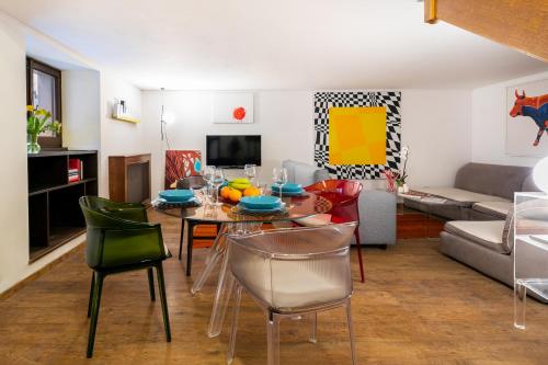 a living room with a table and chairs at Rotonda 23 - Loft in Pantheon in Rome