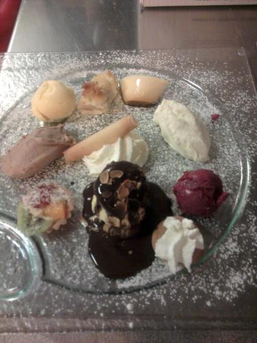 a plate of different types of desserts on a table at Logis Hôtel Restaurant Hostellerie de l'Étoile in Wasselonne