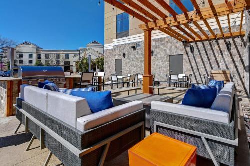 a patio with couches and a pergola at Homewood Suites By Hilton Austin/Cedar Park-Lakeline, Tx in Austin