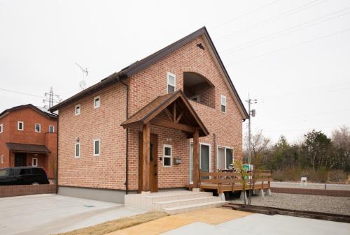 a brick building with a bench on the side at Nasushiobara Renga no ie SORA - Vacation STAY 10890 in Nasushiobara