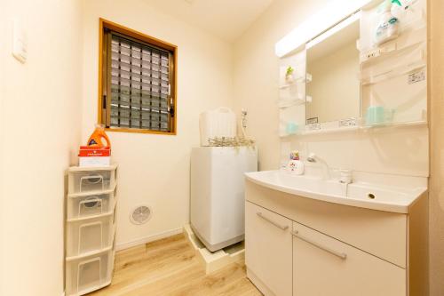 a bathroom with a sink and a refrigerator at BOUTOU - Vacation STAY 34136v in Tokyo