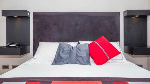 Una cama o camas en una habitación de My Aparts SCL