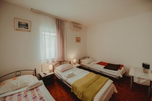 Ένα ή περισσότερα κρεβάτια σε δωμάτιο στο B&B Laguna