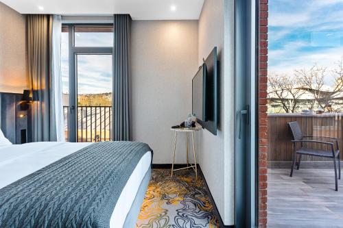 Кровать или кровати в номере Taberne Boutique Hotel Tbilisi