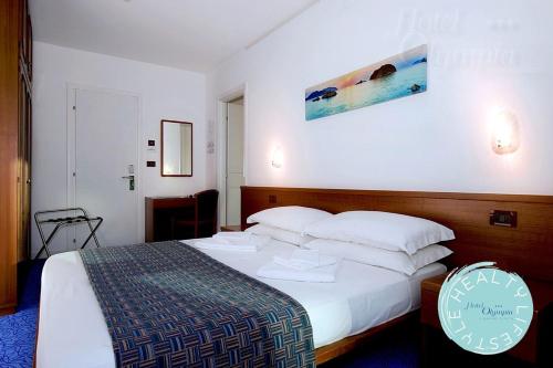 
Postel nebo postele na pokoji v ubytování Hotel Olympia
