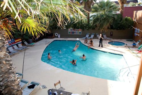 a group of people in a swimming pool at Motel 6 - Las Vegas, NV – Downtown Fremont St Experience in Las Vegas