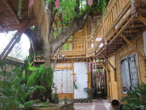 a building with a tree in the middle of it at Tatacoa Star Eco Hotel in Villavieja