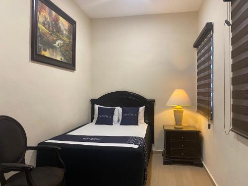 Ένα ή περισσότερα κρεβάτια σε δωμάτιο στο Woo Rooms Hotel