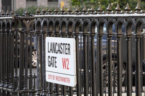 a sign on a fence with a sign on it at Hapimag Apartments London in London