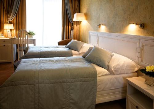Postel nebo postele na pokoji v ubytování Residence Hotel