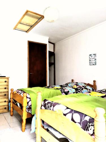 Postel nebo postele na pokoji v ubytování Hostal Caleta Abarca