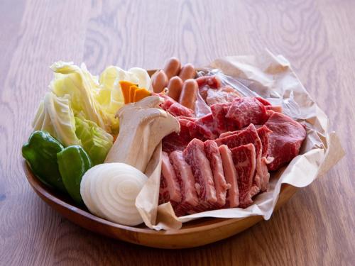 a bowl of meat and vegetables on a table at Matsue Forest Park in Matsue