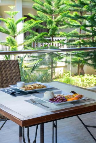 a table with two plates of food on it at MO2 Lagoon Coron in Coron