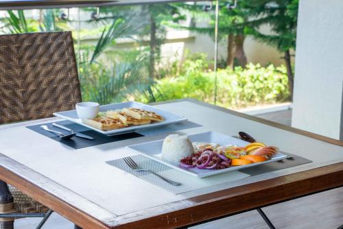 a table with two plates of food on it at MO2 Lagoon Coron in Coron