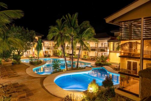 an image of a resort pool at night at MO2 Lagoon Coron in Coron