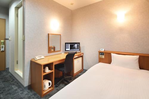 Postel nebo postele na pokoji v ubytování Green Rich Hotel Aso Kumamoto Airport (Artificial hot spring Futamata Yunohana)