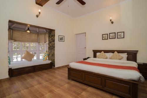 Bhikampur Lodge By Nine Hotelsにあるベッド