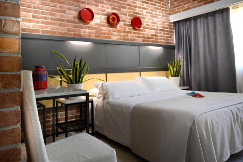 Llit o llits en una habitació de Hotel Marina