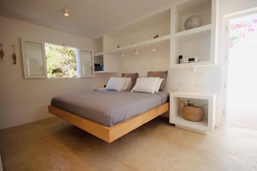 a bedroom with a bed in a room at K-Mari Villa Formentera in Playa Migjorn