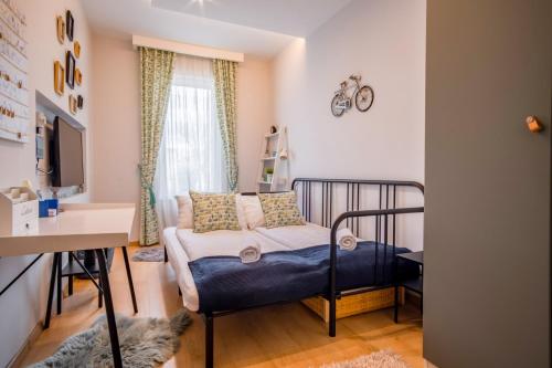 Postel nebo postele na pokoji v ubytování MF Casa Premium Apartment
