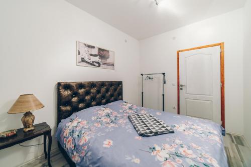 a bedroom with a bed with a keyboard on it at Sreckovic Apartmani 1 in Kragujevac