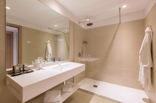 a bathroom with a sink and a mirror at Hotel Lago Di Garda in Nago-Torbole