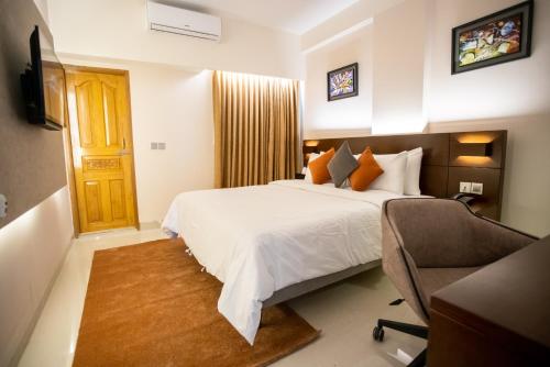 Cama o camas de una habitación en Jatra Flagship Sylhet City Centre