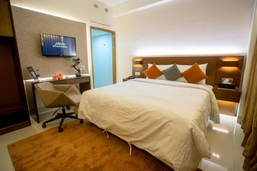 Cama o camas de una habitación en Jatra Flagship Sylhet City Centre