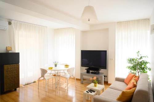 TV a/nebo společenská místnost v ubytování L'Attichetto