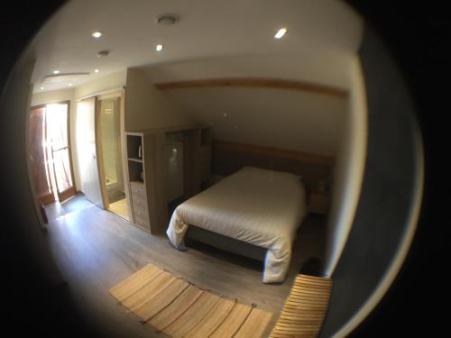 a view of a bedroom with a bed in a room at Beauval Chambre in Seigy