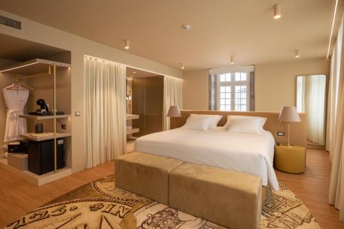 A bed or beds in a room at Zenite Boutique Hotel & SPA