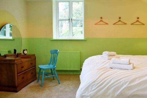 Postel nebo postele na pokoji v ubytování Mill Cottage at Broughton Sanctuary