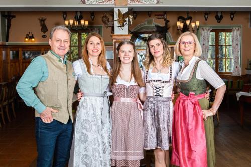 a group of people in dresses posing for a picture at Zum Fally - Landgasthof in Kirchberg am Wechsel