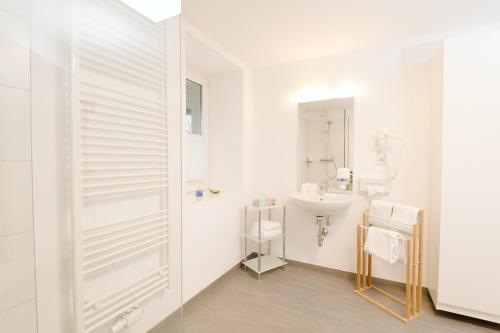 Koupelna v ubytování Velden24 - create your own stay