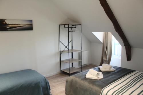Кровать или кровати в номере Aux portes de Guérande