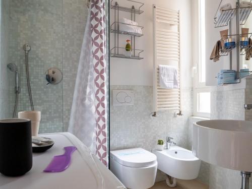 a bathroom with a sink and a toilet and a shower at The Best Rent - Studio Apartment close to Cinque Giornate in Milan