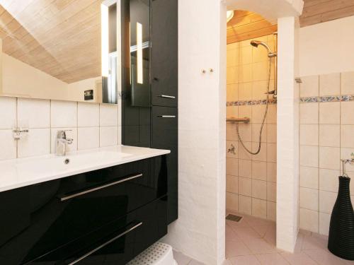 a bathroom with a sink and a shower at 10 person holiday home in Løkken-By Traum in Løkken