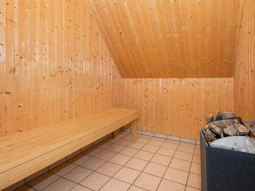 a sauna with a wooden bench in a room at 20 person holiday home in Nordborg-By Traum in Nordborg