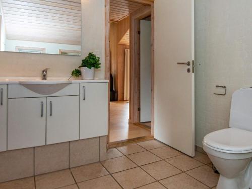 a bathroom with a toilet and a sink at 8 person holiday home in Sydals in Sarup