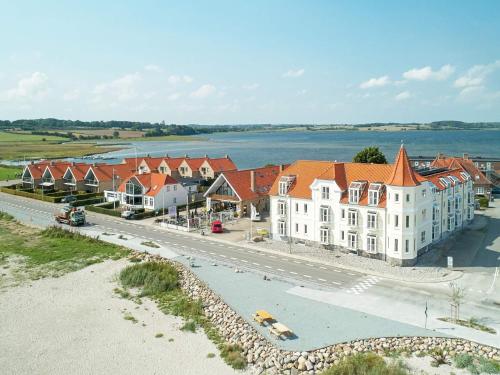 an aerial view of a town with houses and the water at 6 person holiday home on a holiday park in Hejls in Hejls