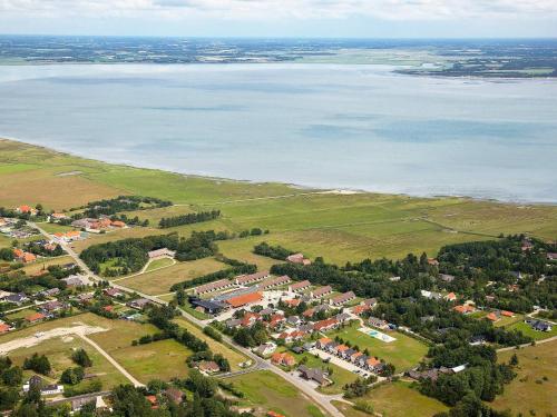 una vista aérea de una ciudad junto al agua en 8 person holiday home on a holiday park in Bl vand, en Blåvand