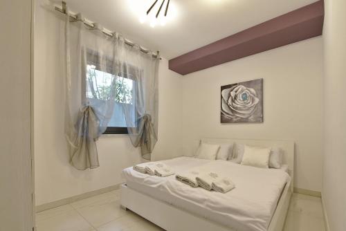 מיטה או מיטות בחדר ב-Apartments Marjanovic
