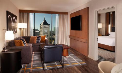 a hotel room with a bed and a television at Grand Hyatt Nashville in Nashville