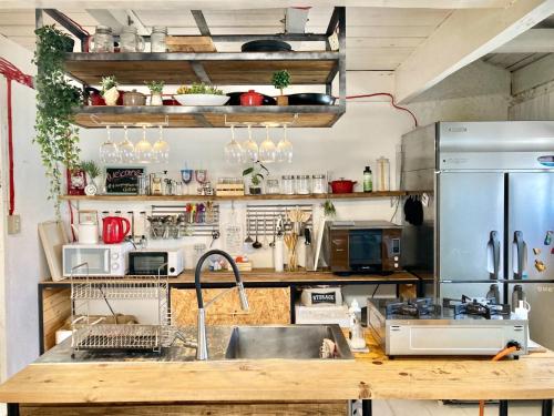 a kitchen with a sink and a refrigerator at Fukuoka - House / Vacation STAY 4898 in Fukuoka