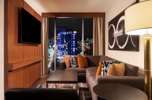 a living room with a couch and a window at Grand Hyatt Nashville in Nashville