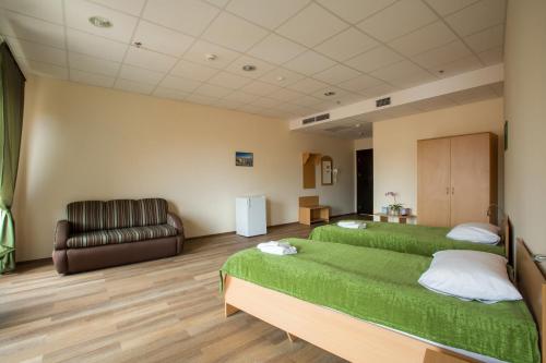 Postel nebo postele na pokoji v ubytování 7 Days City Hotel