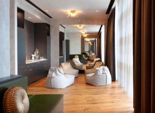 a living room with white couches and a table at Grand Hyatt Nashville in Nashville