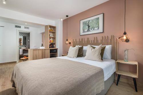 a bedroom with a large bed in a room at Linda Boutique Hotel in Marbella